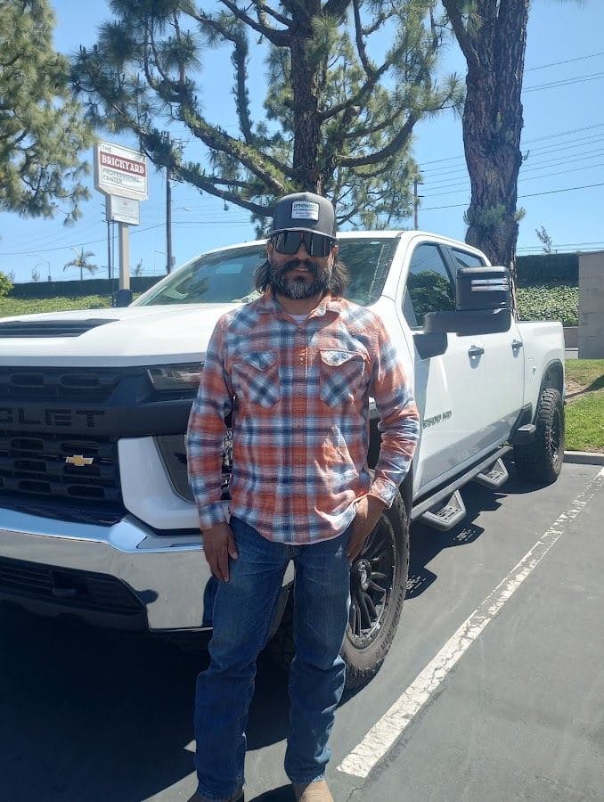 Othoniel's Junk Removal Service owner with the company truck